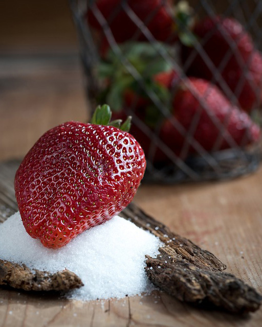 Strawberry On Sugar On Driftwood